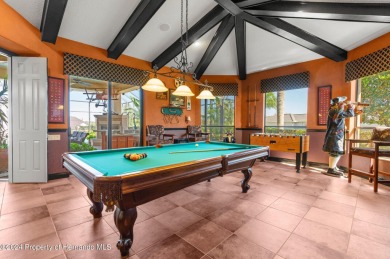 This superior pool home will truly take your breath away on Lake Jovita Golf and Country Club in Florida - for sale on GolfHomes.com, golf home, golf lot