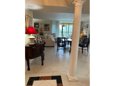 EXPERIENCE THE LUXURY LIVING IN THIS LARGE AND CAPTIVATING 2 BED on Jim McLean Signature Course in Florida - for sale on GolfHomes.com, golf home, golf lot