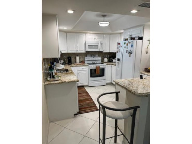 EXPERIENCE THE LUXURY LIVING IN THIS LARGE AND CAPTIVATING 2 BED on Jim McLean Signature Course in Florida - for sale on GolfHomes.com, golf home, golf lot