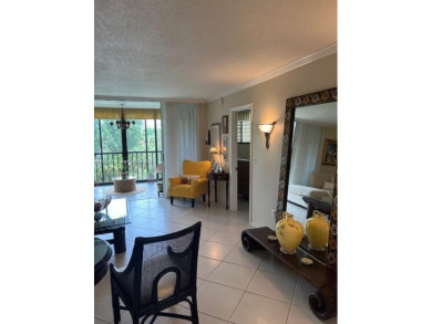 EXPERIENCE THE LUXURY LIVING IN THIS LARGE AND CAPTIVATING 2 BED on Jim McLean Signature Course in Florida - for sale on GolfHomes.com, golf home, golf lot