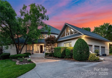 Escape to this sleek 5 bed, 4.5 bath two story contemporary home on Carmel Country Club in North Carolina - for sale on GolfHomes.com, golf home, golf lot