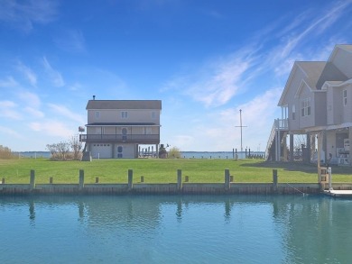 Looking for breathtaking views of the Chincoteague Bay, a front on Captains Cove Golf and Yacht Club in Virginia - for sale on GolfHomes.com, golf home, golf lot