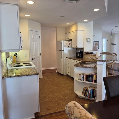 Discover refined Florida living in this beautifully appointed on Riverwood Golf Club in Florida - for sale on GolfHomes.com, golf home, golf lot