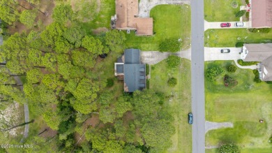 Welcome to this spacious 4-bedroom, 2-bath home in the on Harbour Point Golf Club in North Carolina - for sale on GolfHomes.com, golf home, golf lot