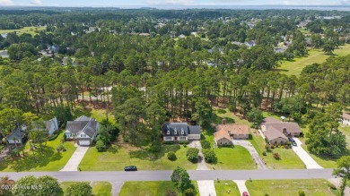 Welcome to this spacious 4-bedroom, 2-bath home in the on Harbour Point Golf Club in North Carolina - for sale on GolfHomes.com, golf home, golf lot
