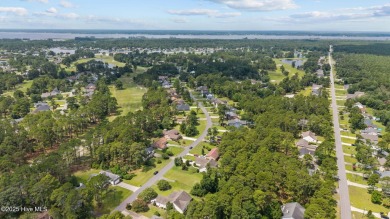 Welcome to this spacious 4-bedroom, 2-bath home in the on Harbour Point Golf Club in North Carolina - for sale on GolfHomes.com, golf home, golf lot