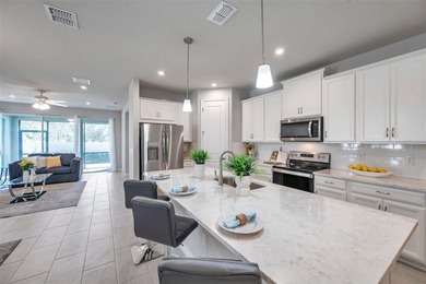 Don't miss your chance to own the stunning Topsail model home in on The Golf Club of Cypress Creek in Florida - for sale on GolfHomes.com, golf home, golf lot