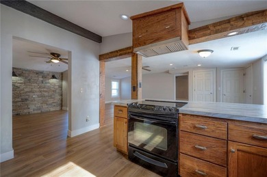 This home is the perfect blend of comfort, charm, function, and on Linn Valley Lakes - Deer Trace Golf Course in Kansas - for sale on GolfHomes.com, golf home, golf lot