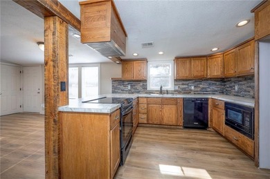 This home is the perfect blend of comfort, charm, function, and on Linn Valley Lakes - Deer Trace Golf Course in Kansas - for sale on GolfHomes.com, golf home, golf lot