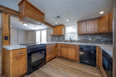 This home is the perfect blend of comfort, charm, function, and on Linn Valley Lakes - Deer Trace Golf Course in Kansas - for sale on GolfHomes.com, golf home, golf lot