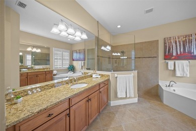 Driving through the gates of prestigious Country Club East, you on Ritz-Carlton Members Golf Club in Florida - for sale on GolfHomes.com, golf home, golf lot