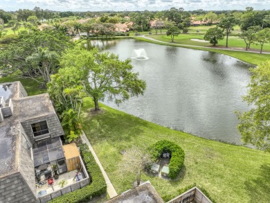 Unmatched, spectacular views of the lake and golf course await on PGA National Golf Club in Florida - for sale on GolfHomes.com, golf home, golf lot