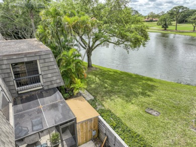 Unmatched, spectacular views of the lake and golf course await on PGA National Golf Club in Florida - for sale on GolfHomes.com, golf home, golf lot