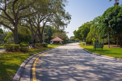 Unmatched, spectacular views of the lake and golf course await on PGA National Golf Club in Florida - for sale on GolfHomes.com, golf home, golf lot