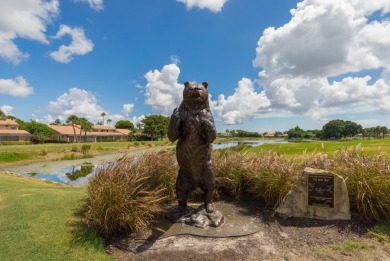 Unmatched, spectacular views of the lake and golf course await on PGA National Golf Club in Florida - for sale on GolfHomes.com, golf home, golf lot