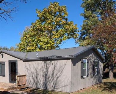 This home is the perfect blend of comfort, charm, function, and on Linn Valley Lakes - Deer Trace Golf Course in Kansas - for sale on GolfHomes.com, golf home, golf lot