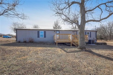 This home is the perfect blend of comfort, charm, function, and on Linn Valley Lakes - Deer Trace Golf Course in Kansas - for sale on GolfHomes.com, golf home, golf lot