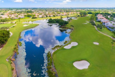 Unmatched, spectacular views of the lake and golf course await on PGA National Golf Club in Florida - for sale on GolfHomes.com, golf home, golf lot