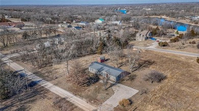 This home is the perfect blend of comfort, charm, function, and on Linn Valley Lakes - Deer Trace Golf Course in Kansas - for sale on GolfHomes.com, golf home, golf lot