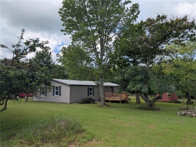 This home is the perfect blend of comfort, charm, function, and on Linn Valley Lakes - Deer Trace Golf Course in Kansas - for sale on GolfHomes.com, golf home, golf lot