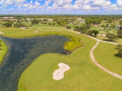 Unmatched, spectacular views of the lake and golf course await on PGA National Golf Club in Florida - for sale on GolfHomes.com, golf home, golf lot