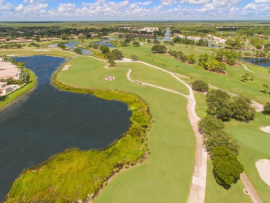 Unmatched, spectacular views of the lake and golf course await on PGA National Golf Club in Florida - for sale on GolfHomes.com, golf home, golf lot