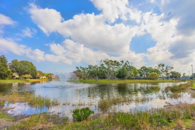 Unmatched, spectacular views of the lake and golf course await on PGA National Golf Club in Florida - for sale on GolfHomes.com, golf home, golf lot