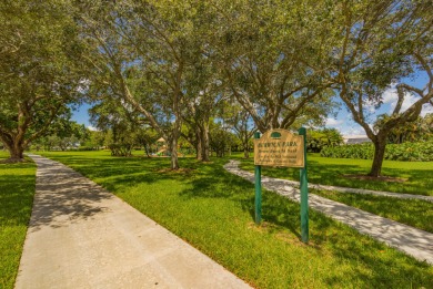 Unmatched, spectacular views of the lake and golf course await on PGA National Golf Club in Florida - for sale on GolfHomes.com, golf home, golf lot