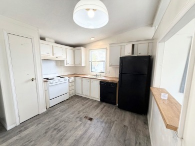 PRICED TO SELL!!! This 2-bedroom, 2 full bath home needs someone on Grasslands Golf and Country Club in Florida - for sale on GolfHomes.com, golf home, golf lot