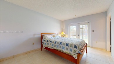 Discover your dream home in this beautifully designed residence on Palmetto Golf Course in Florida - for sale on GolfHomes.com, golf home, golf lot