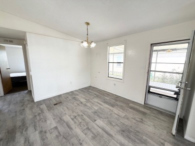 PRICED TO SELL!!! This 2-bedroom, 2 full bath home needs someone on Grasslands Golf and Country Club in Florida - for sale on GolfHomes.com, golf home, golf lot