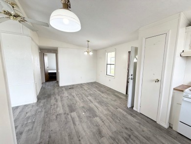 PRICED TO SELL!!! This 2-bedroom, 2 full bath home needs someone on Grasslands Golf and Country Club in Florida - for sale on GolfHomes.com, golf home, golf lot