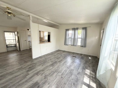 PRICED TO SELL!!! This 2-bedroom, 2 full bath home needs someone on Grasslands Golf and Country Club in Florida - for sale on GolfHomes.com, golf home, golf lot