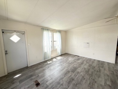 PRICED TO SELL!!! This 2-bedroom, 2 full bath home needs someone on Grasslands Golf and Country Club in Florida - for sale on GolfHomes.com, golf home, golf lot