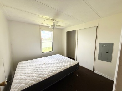 PRICED TO SELL!!! This 2-bedroom, 2 full bath home needs someone on Grasslands Golf and Country Club in Florida - for sale on GolfHomes.com, golf home, golf lot