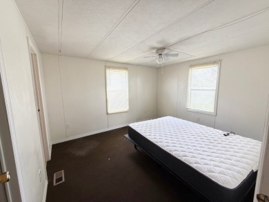 PRICED TO SELL!!! This 2-bedroom, 2 full bath home needs someone on Grasslands Golf and Country Club in Florida - for sale on GolfHomes.com, golf home, golf lot