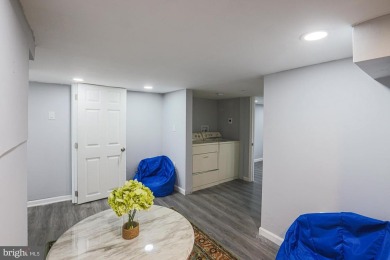 This charming end-of-row townhouse, built in 1924, seamlessly on Clifton Park Golf Course in Maryland - for sale on GolfHomes.com, golf home, golf lot