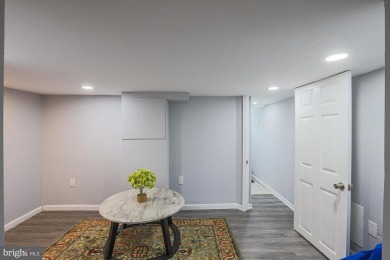This charming end-of-row townhouse, built in 1924, seamlessly on Clifton Park Golf Course in Maryland - for sale on GolfHomes.com, golf home, golf lot