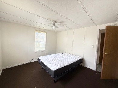 PRICED TO SELL!!! This 2-bedroom, 2 full bath home needs someone on Grasslands Golf and Country Club in Florida - for sale on GolfHomes.com, golf home, golf lot