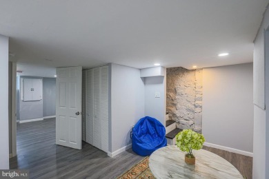 This charming end-of-row townhouse, built in 1924, seamlessly on Clifton Park Golf Course in Maryland - for sale on GolfHomes.com, golf home, golf lot