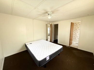 PRICED TO SELL!!! This 2-bedroom, 2 full bath home needs someone on Grasslands Golf and Country Club in Florida - for sale on GolfHomes.com, golf home, golf lot