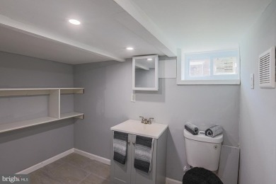 This charming end-of-row townhouse, built in 1924, seamlessly on Clifton Park Golf Course in Maryland - for sale on GolfHomes.com, golf home, golf lot
