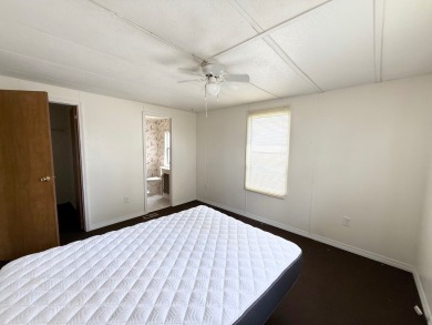 PRICED TO SELL!!! This 2-bedroom, 2 full bath home needs someone on Grasslands Golf and Country Club in Florida - for sale on GolfHomes.com, golf home, golf lot