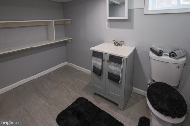 This charming end-of-row townhouse, built in 1924, seamlessly on Clifton Park Golf Course in Maryland - for sale on GolfHomes.com, golf home, golf lot