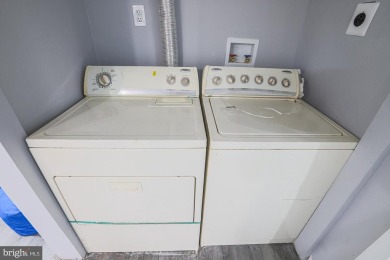 This charming end-of-row townhouse, built in 1924, seamlessly on Clifton Park Golf Course in Maryland - for sale on GolfHomes.com, golf home, golf lot