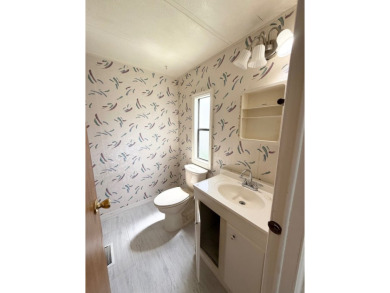 PRICED TO SELL!!! This 2-bedroom, 2 full bath home needs someone on Grasslands Golf and Country Club in Florida - for sale on GolfHomes.com, golf home, golf lot