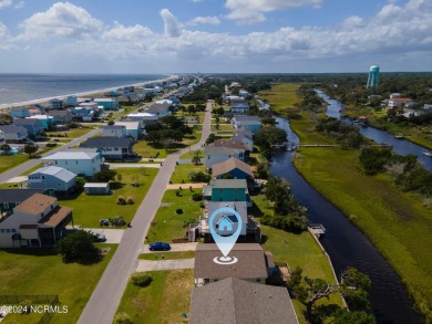 Price Reduction! Enjoy a third-row beach home that has a dock on on Founders Club At St. James Plantation in North Carolina - for sale on GolfHomes.com, golf home, golf lot