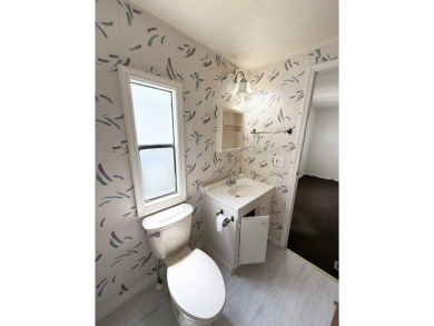 PRICED TO SELL!!! This 2-bedroom, 2 full bath home needs someone on Grasslands Golf and Country Club in Florida - for sale on GolfHomes.com, golf home, golf lot