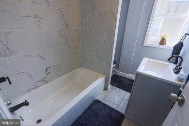 This charming end-of-row townhouse, built in 1924, seamlessly on Clifton Park Golf Course in Maryland - for sale on GolfHomes.com, golf home, golf lot