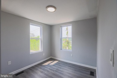 This charming end-of-row townhouse, built in 1924, seamlessly on Clifton Park Golf Course in Maryland - for sale on GolfHomes.com, golf home, golf lot